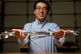 Xiao Li, a materials scientist at PNNL, holds samples of highly conductive metal wires created on the patented ShAPE platform. Photo: Andrea Starr/Pacific Northwest National Laboratory.